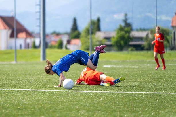 istock Sliding tackle on soccer pitch 1444291716