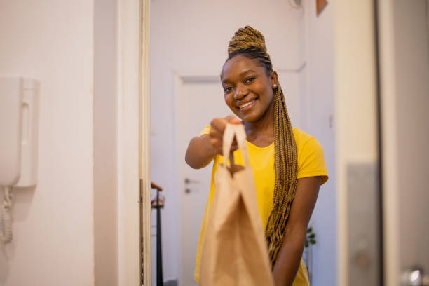 istock Volunteer at the door with the package 1444292143