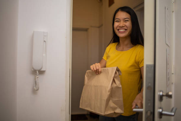 istock Volunteer at the door with the package 1444292418