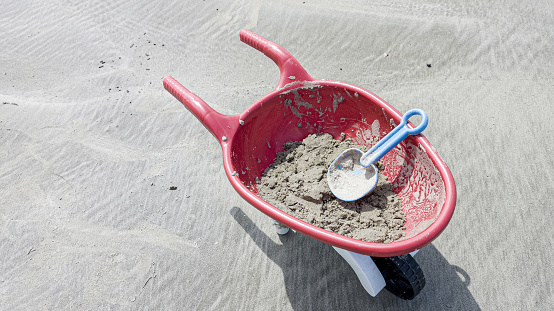 kids wheelbarrow in Beach sand