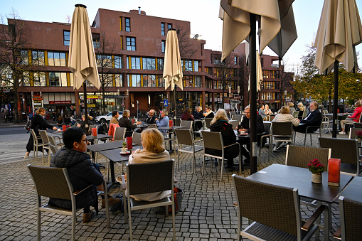 Münster, Germany, October 18, 2022 - Street café in front of the LWL - Museum of Art and Culture at the Aegidiimarkt in Münster.