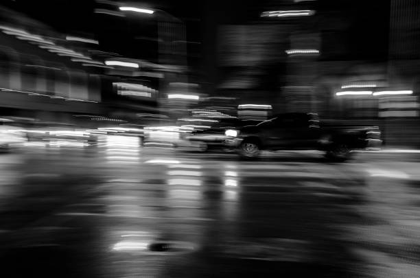 istock PICK-UP TRUCK AT NIGHT IN MOTION BLUR 1444314940