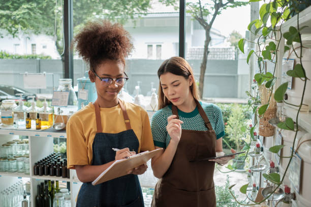 istock Two shopkeepers check stock in zero waste and plastic-free grocery store. 1444315524