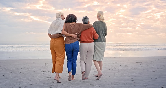 Love, beach and back of friends on holiday for peace, relax and travel in Costa Rica. Support, walk and senior group of women walking on by the ocean during a retirement vacation together in summer