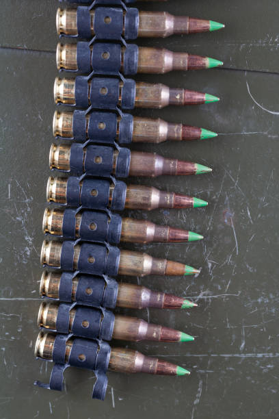 istock 5.56mm ammunition belt with cartridges 1444320332