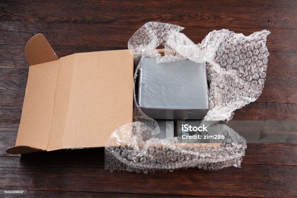Hand made bomb with c4 and cell phone module in a cardboard box Bomb Stock Photo