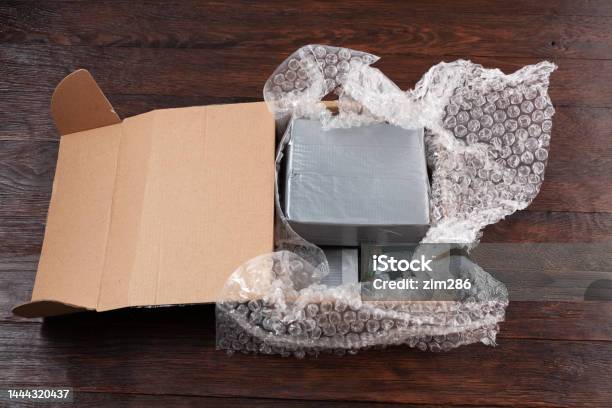 Hand Made Bomb With C4 And Cell Phone Module In A Cardboard Box Stock Photo - Download Image Now