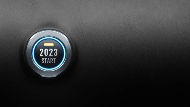 Start engine car button on black leather, happy new year 2023 start new project stock photo