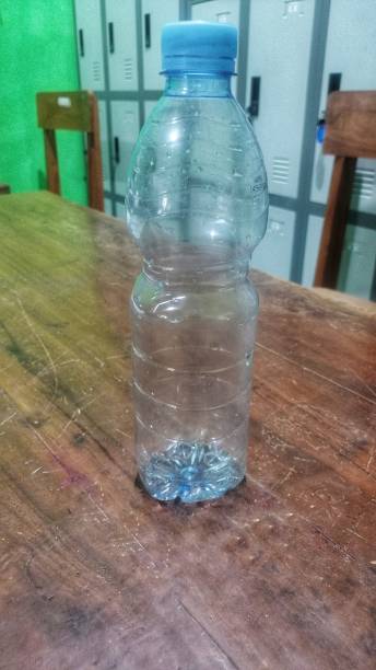 istock Closeup of plastic bootle on the wooden table 1444322153