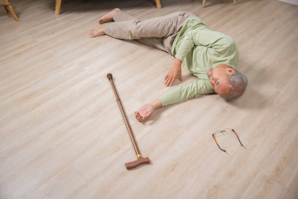 istock Sick senior old man falling down lying on the ground because stumbled at home 1444323240