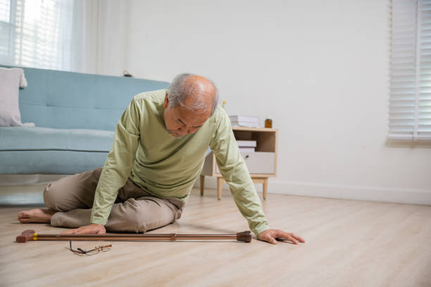 istock Older senior man headache lying on the floor after falling 1444323243