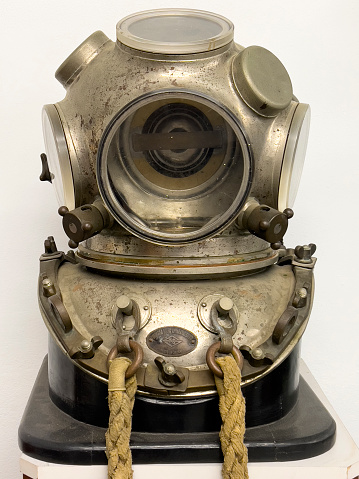 Old diving suit with copy space. Traditional deep sea equipment for sponge divers.