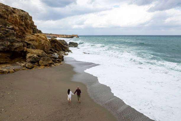 istock Couple on a beach vacation. 1444326301