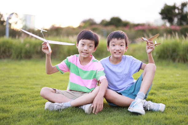 istock Young boy playing with airplane toy 1444327161