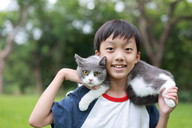 istock Little boy and his cat 1444327785