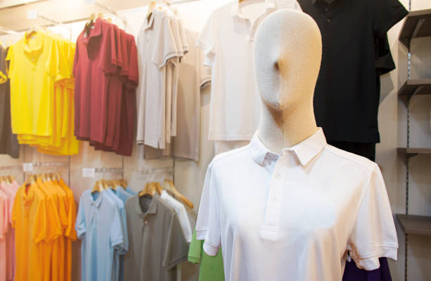 istock Mannequin with white shirt in clothing store 1444343640
