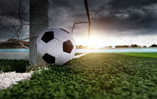Single soccer ball is outside the goal