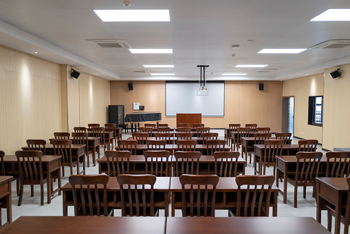 Elderly university music classroom, rows of tables and chairs