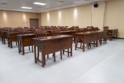 Elderly university music classroom, rows of tables and chairs