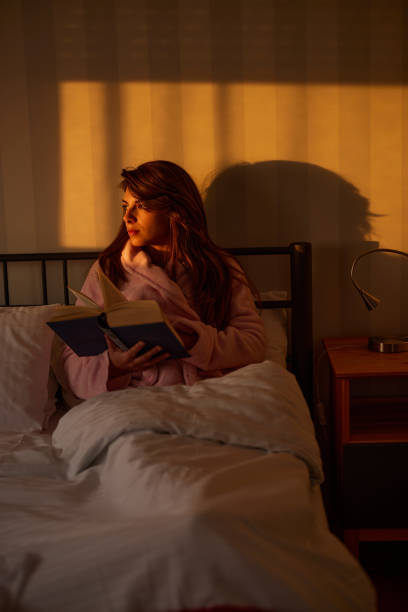 istock Young woman relaxing on a bed. 1444353063