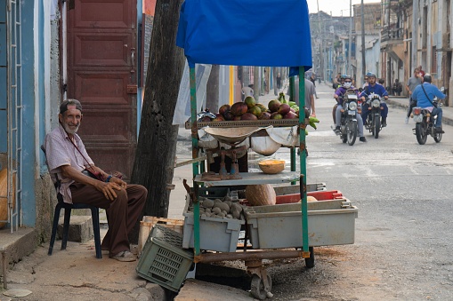 Matanzas, Cuba – June 02, 2022: a View of an old man sells fruit on the street
