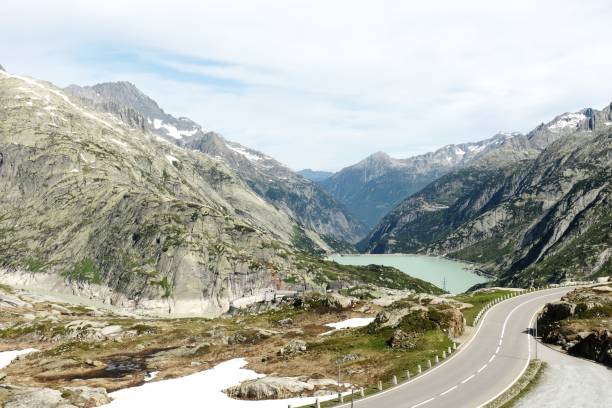 istock Mountain, dam, and road at Grimsel Pass in Switzerland 1444356995