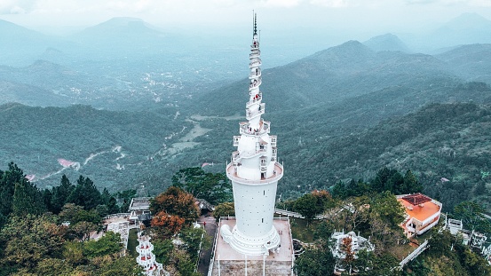 Aerial view of Ambuluwawa tower is a temple of four religions central Sri Lanka. Tower rises above the jungle on a high mountain.