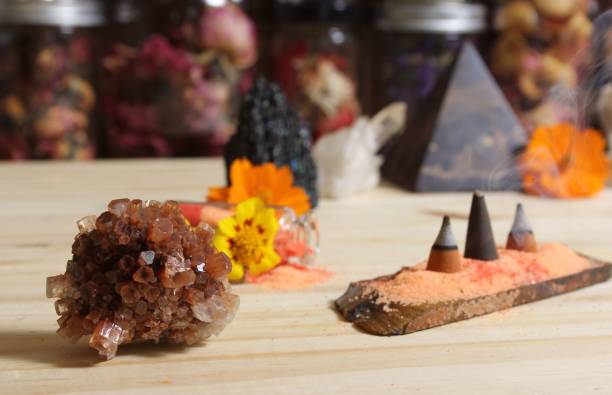 istock Aragonite Crystal With Incense and Stone Pyramid on Meditation Altar 1444357905