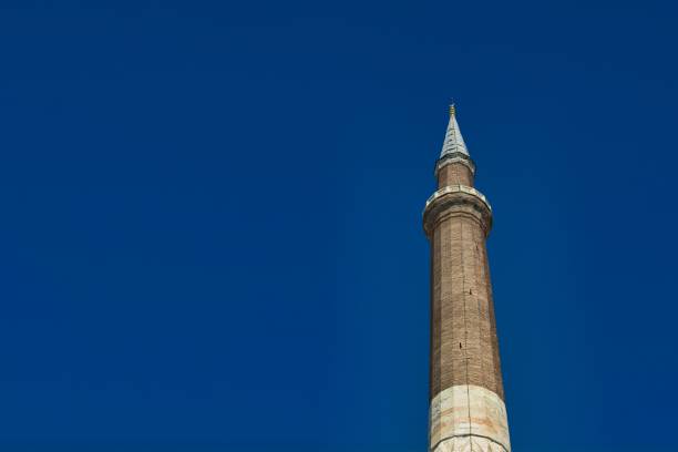 istock Low angle shot of a minaret against a cloudless blue sky 1444358021