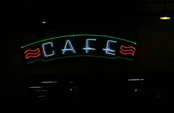 istock Vintage Neon Cafe Sign on Small Town Restaurant 1444358100