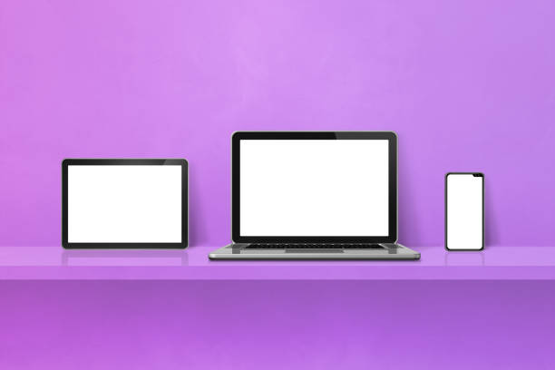 istock Laptop, mobile phone and digital tablet pc on purple wall shelf. Horizontal background 1444359415