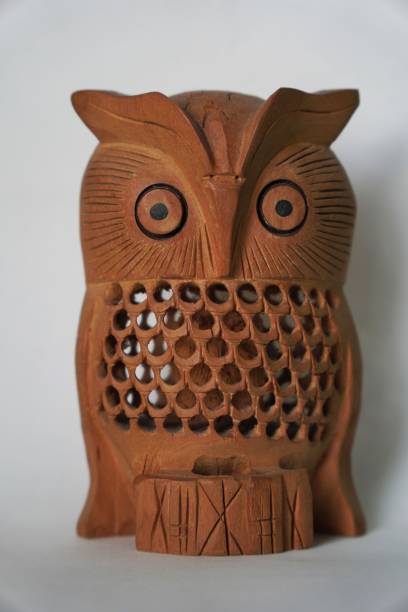 istock Wooden owl artifact model isolated on white background 1444360675