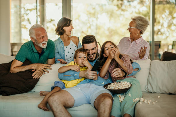 istock Family popcorn and sofa time 1444361073