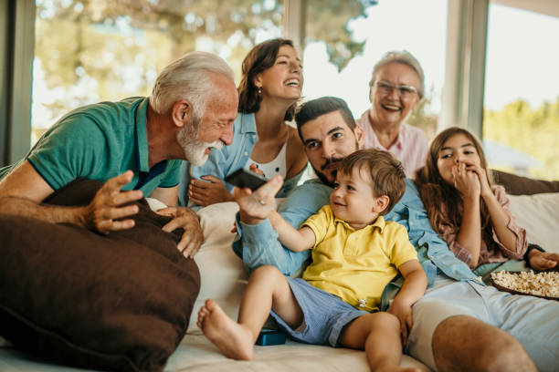 istock Family popcorn and sofa time 1444361076