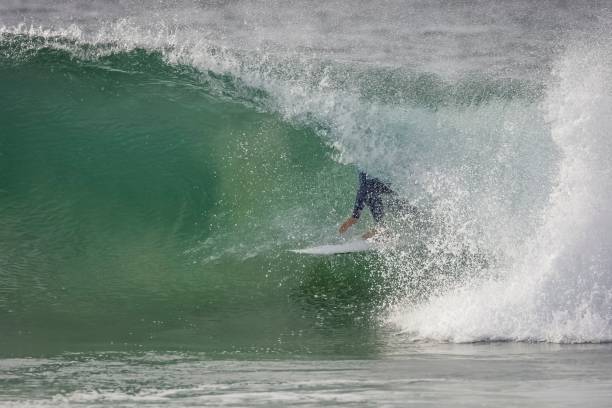 istock Surfer riding waves in Jeffreys Bay, South Africa 1444361232
