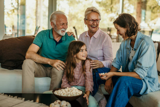 istock Family popcorn and sofa time 1444361523