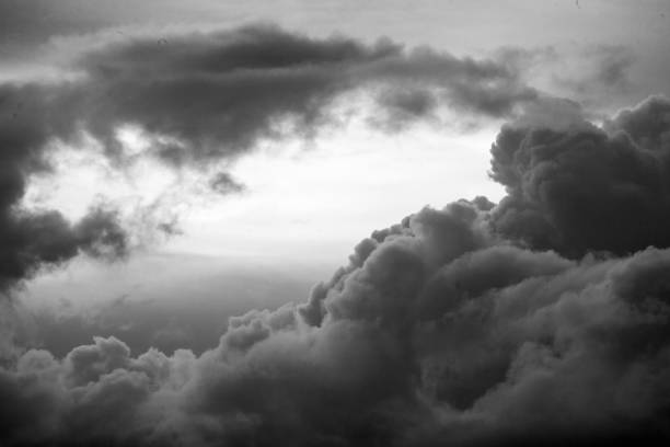 A grayscale aerial of clouds in the sky