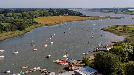 An aerial view of boats sailing in the Deben River in Suffolk, England
