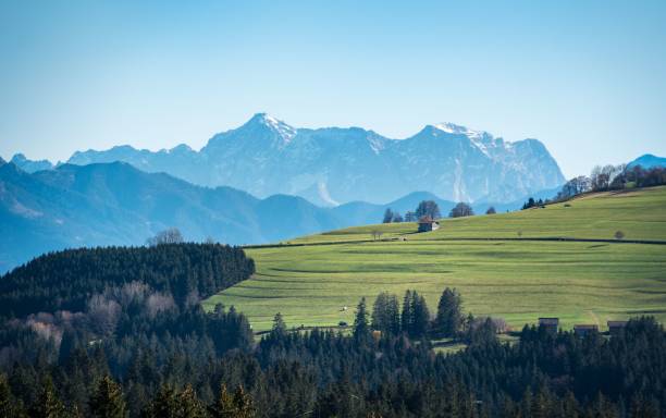 istock Wide green field with a mountain background 1444362906