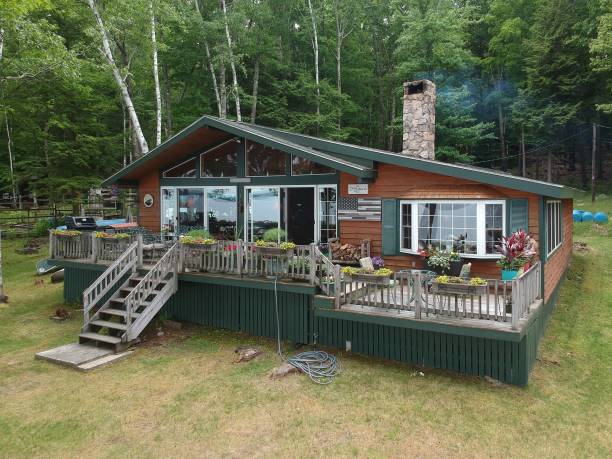 istock Raised wooden country house surrounded by trees 1444363145