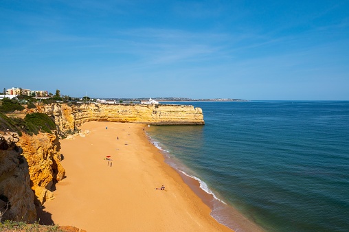 A beautiful view of the Praia Nova beach on a sunny day in Porches, Portugal