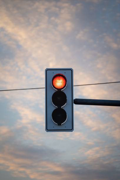 istock Closeup shot of a red traffic light during sunset 1444365090
