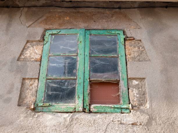 istock Closeup shot of an old weathered window 1444365219