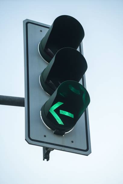 istock Closeup shot of a traffic light with turn left light on 1444365551