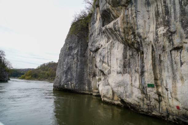 istock View of a river flowing next to huge cliffs 1444366918