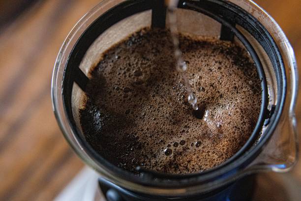 istock Selective focus of pour over coffee with water droplets 1444367359