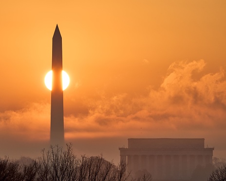 Sunrise at Washington DC where the sun was right at the back of Washington Monument and Lincoln Memorial