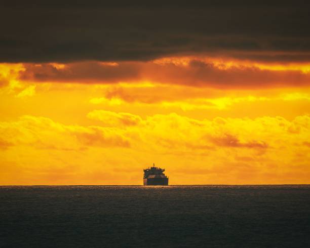 istock View of the ship in the water on a sunset 1444373420
