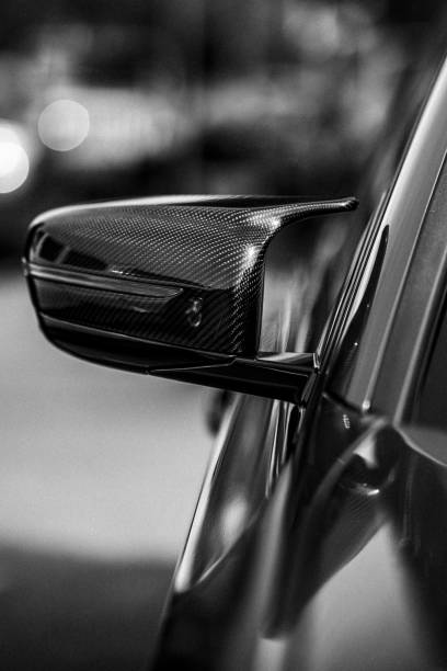 istock Vertical grayscale partial view of a car side-view mirror 1444375478