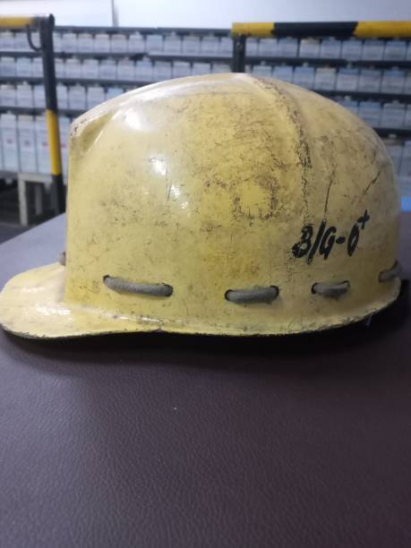 istock A safety helmet on brown surface 1444375610